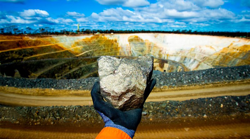 Image of someone holding a large nickel ore in a nickel mining area to support nickel mining article