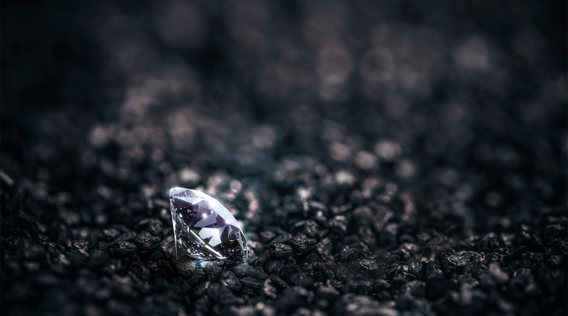 Diamond in pieces of black coal to support 4.38-carat diamond article